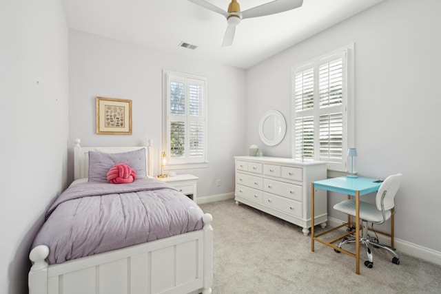 bedroom featuring light carpet and ceiling fan