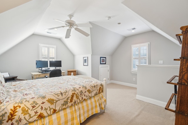 bedroom featuring ceiling fan, light colored carpet, and vaulted ceiling