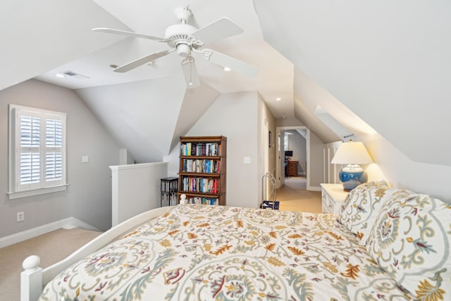 bedroom with vaulted ceiling, light colored carpet, and ceiling fan