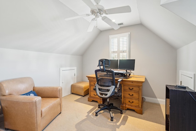 home office featuring ceiling fan, lofted ceiling, and light carpet