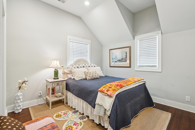 bedroom featuring dark wood-type flooring and lofted ceiling