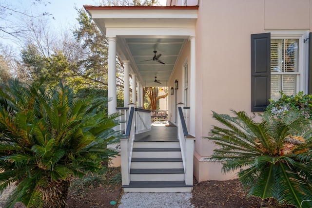 doorway to property with ceiling fan