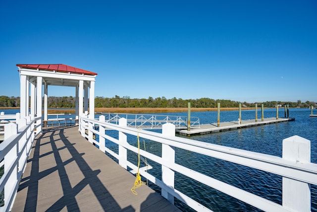 dock area featuring a gazebo and a water view