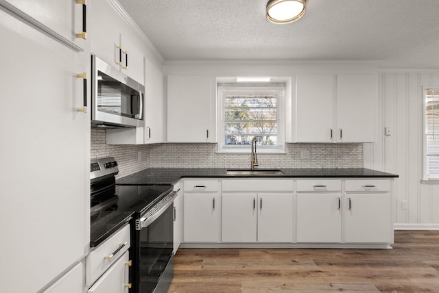 kitchen with white cabinetry and stainless steel appliances