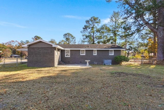 back of property featuring a yard, a patio, and central AC unit