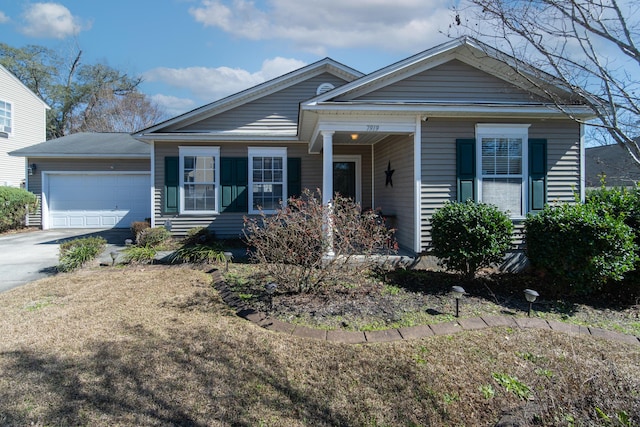 view of front of home with driveway and an attached garage