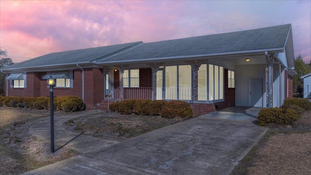 view of front of property with a carport