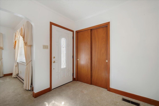 2830 Wire Rd, Saint George, SC 29477 - carpeted entryway featuring crown molding and baseboard heating