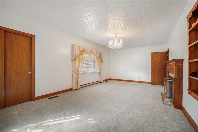 2830 Wire Rd, Saint George, SC 29477 - unfurnished living room featuring an inviting chandelier, light colored carpet, ornamental molding, and a textured ceiling