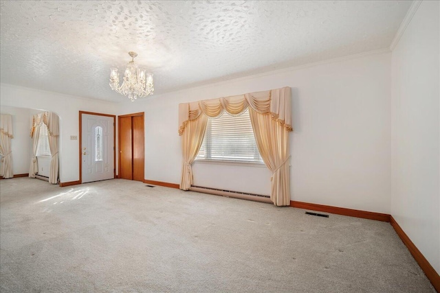2830 Wire Rd, Saint George, SC 29477 - unfurnished room with ornamental molding, a notable chandelier, baseboard heating, light carpet, and a textured ceiling