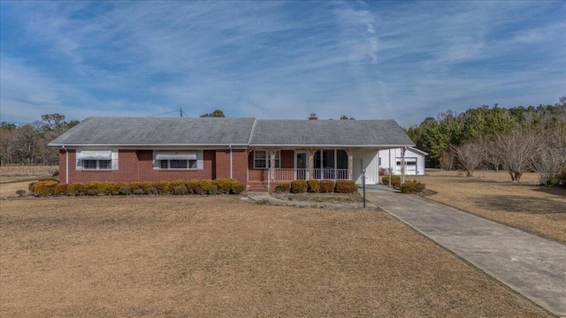 2830 Wire Rd, Saint George, SC 29477 - ranch-style home with a porch, a garage, a carport, and a front yard