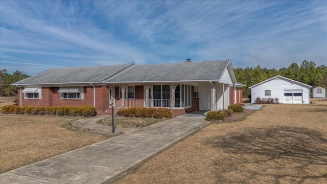 2830 Wire Rd, Saint George, SC 29477 - ranch-style house with an outbuilding, a porch, a garage, and a front yard
