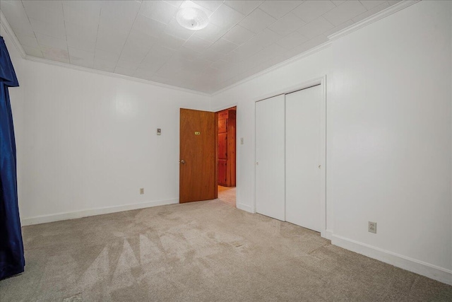 2830 Wire Rd, Saint George, SC 29477 - unfurnished bedroom featuring light carpet, ornamental molding, and a closet