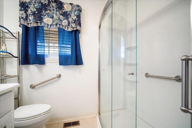 2830 Wire Rd, Saint George, SC 29477 - bathroom featuring vanity, a shower with shower door, tile patterned floors, and toilet