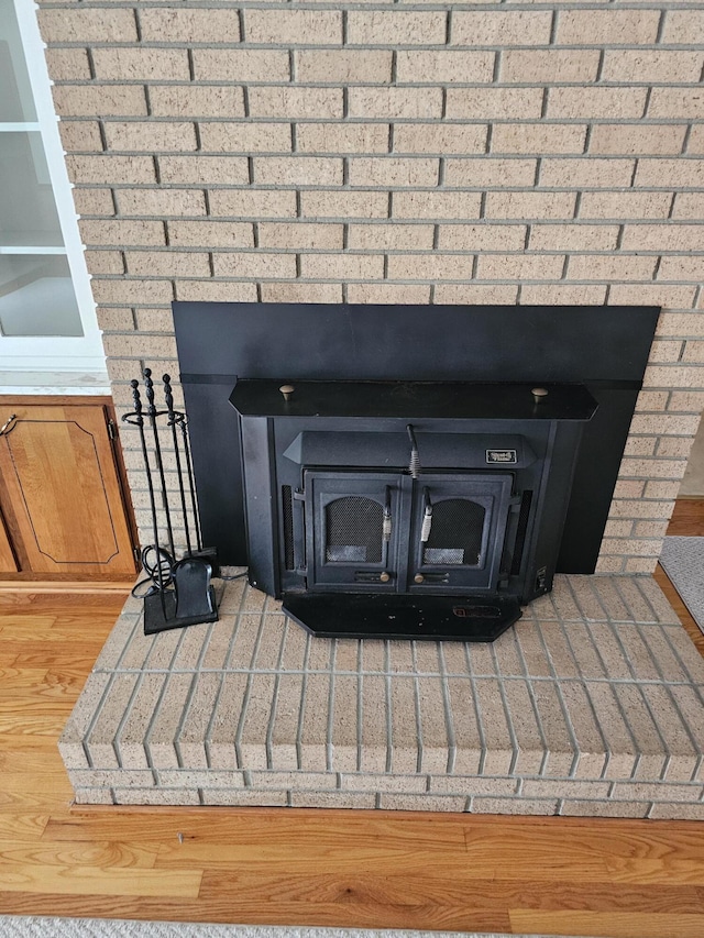 2830 Wire Rd, Saint George, SC 29477 - room details with wood-type flooring and a wood stove