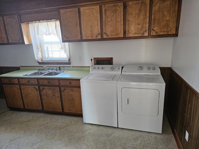 2830 Wire Rd, Saint George, SC 29477 - washroom with sink, wooden walls, washing machine and dryer, and cabinets