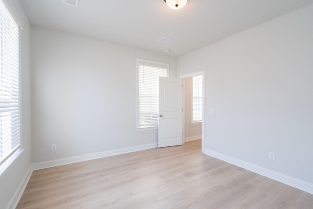 unfurnished room featuring light hardwood / wood-style flooring