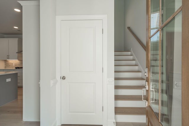 stairway with wood-type flooring