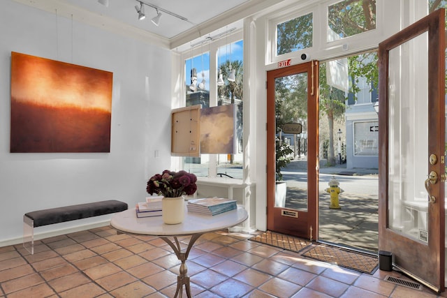 doorway featuring track lighting