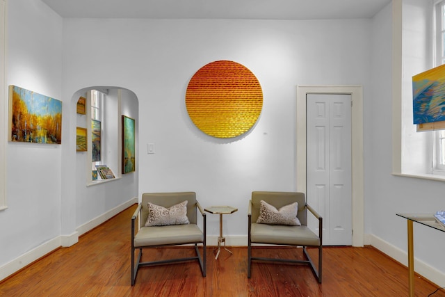 sitting room featuring light hardwood / wood-style floors