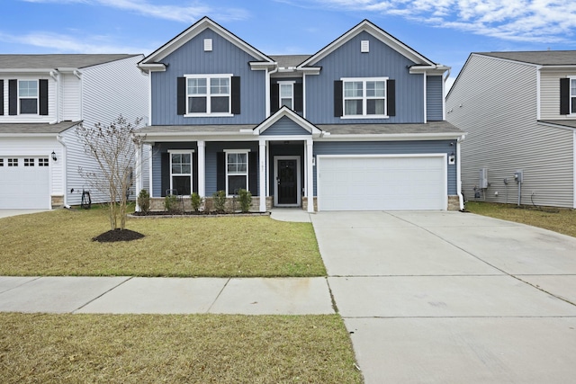 view of front of home with a garage and a front yard