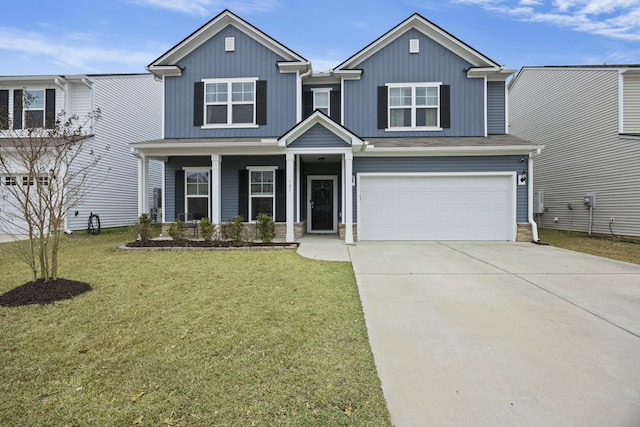 view of front facade featuring a garage, a front lawn, and a porch