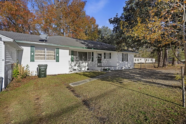 back of house featuring a yard