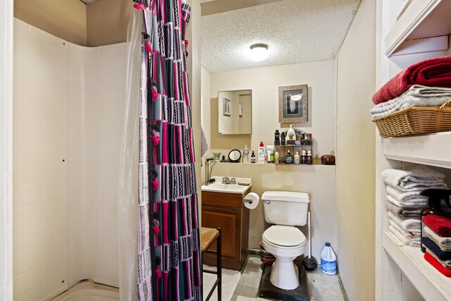 full bathroom featuring vanity, toilet, a textured ceiling, and shower / tub combo with curtain