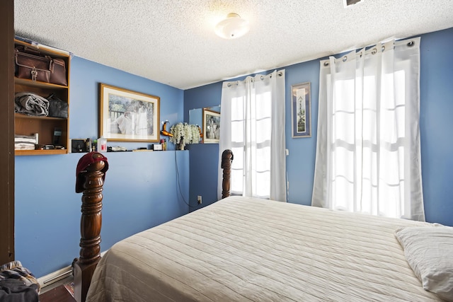 bedroom featuring a textured ceiling