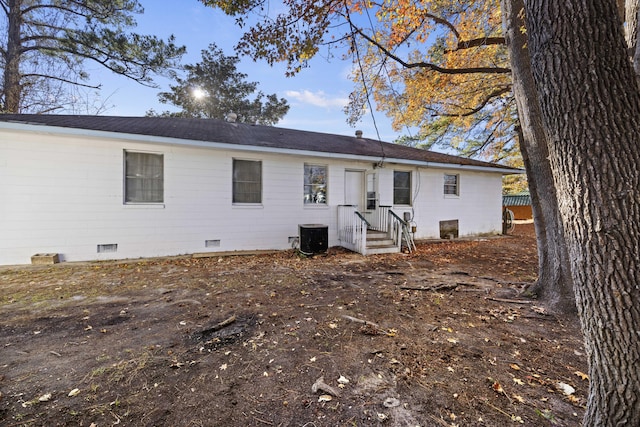 back of house featuring cooling unit