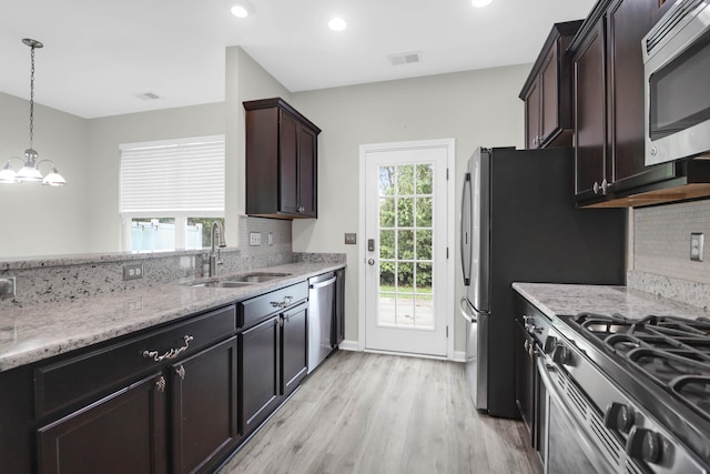 1510 Royal Colony Rd, Johns Island, SC 29455 - kitchen with a sink, stainless steel appliances, light wood-style floors, backsplash, and recessed lighting