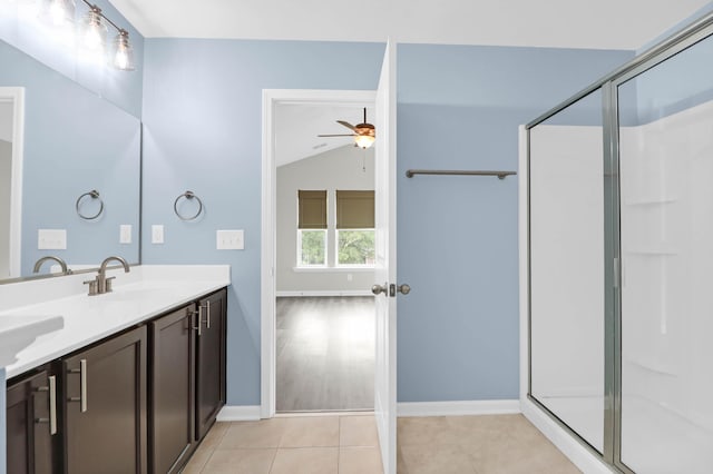 1510 Royal Colony Rd, Johns Island, SC 29455 - bathroom featuring ceiling fan, double vanity, a shower stall, vaulted ceiling, and baseboards