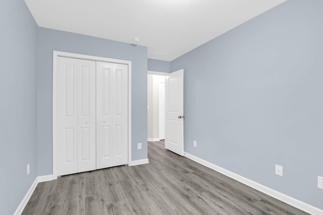 1510 Royal Colony Rd, Johns Island, SC 29455 - unfurnished bedroom featuring wood finished floors, baseboards, and a closet