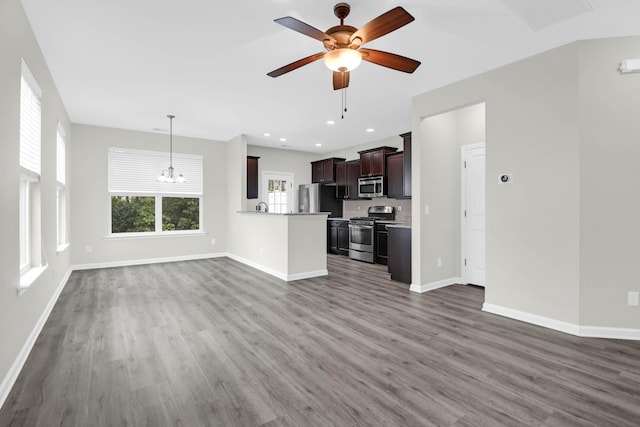 1510 Royal Colony Rd, Johns Island, SC 29455 - unfurnished living room featuring a chandelier, wood finished floors, baseboards, and recessed lighting