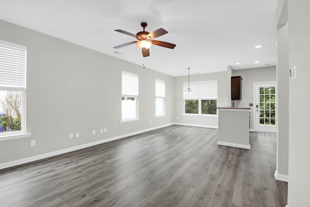 1510 Royal Colony Rd, Johns Island, SC 29455 - unfurnished living room featuring dark wood finished floors, a ceiling fan, baseboards, recessed lighting, and a sink
