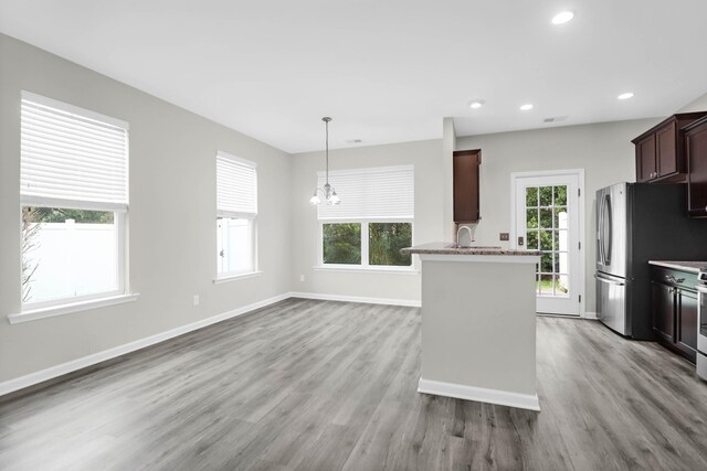 1510 Royal Colony Rd, Johns Island, SC 29455 - kitchen with wood finished floors, baseboards, recessed lighting, freestanding refrigerator, and a chandelier