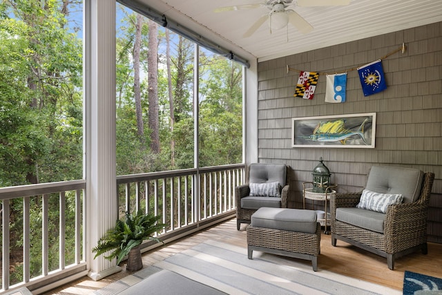 sunroom with plenty of natural light and a ceiling fan