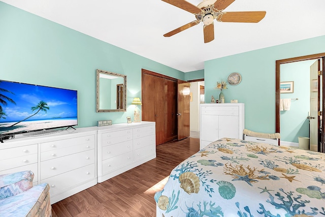 bedroom with a closet, ceiling fan, and dark hardwood / wood-style flooring