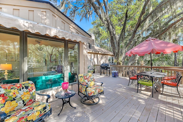 wooden deck featuring area for grilling