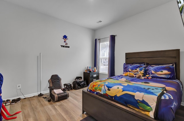 bedroom featuring wood-type flooring