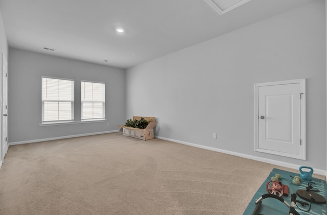 interior space featuring light colored carpet