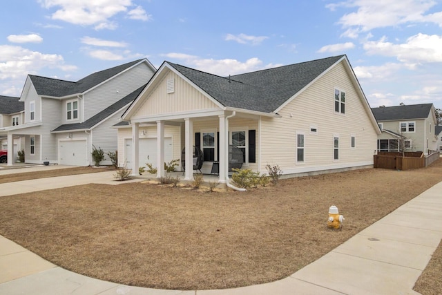 view of front of property with a porch and a garage