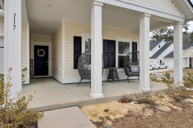 view of exterior entry featuring a porch