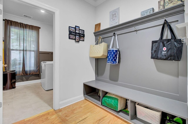 mudroom with wood-type flooring