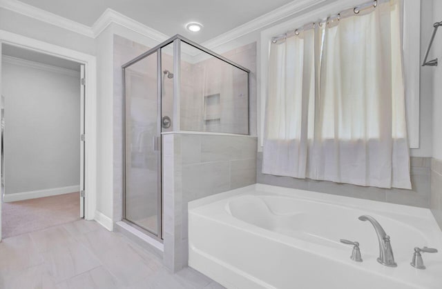 bathroom with crown molding and independent shower and bath