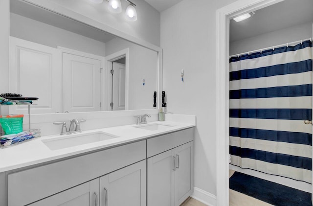 bathroom featuring tile patterned floors and vanity