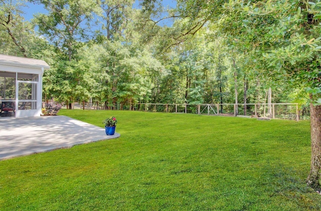 view of yard featuring a sunroom