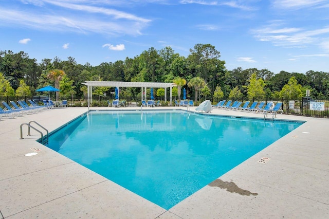 view of pool featuring a pergola and a patio