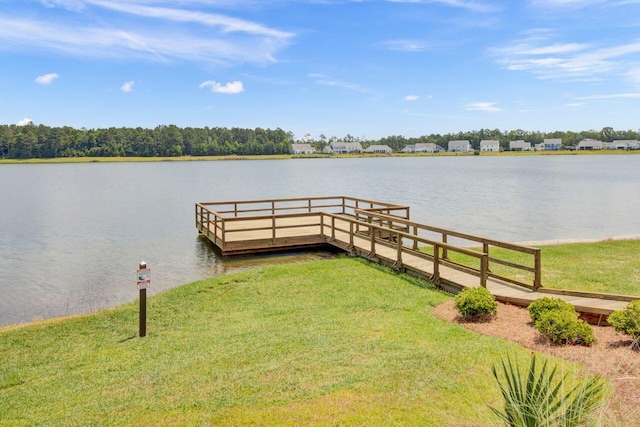 view of dock featuring a water view and a yard