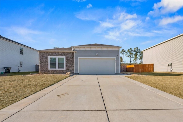 view of front of house featuring a front yard and a garage